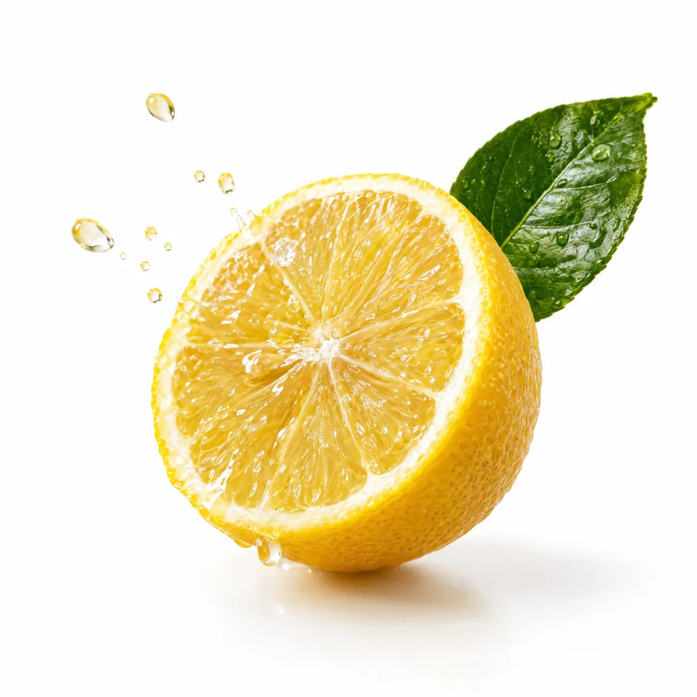 A freshly halved lemon with droplets of juice